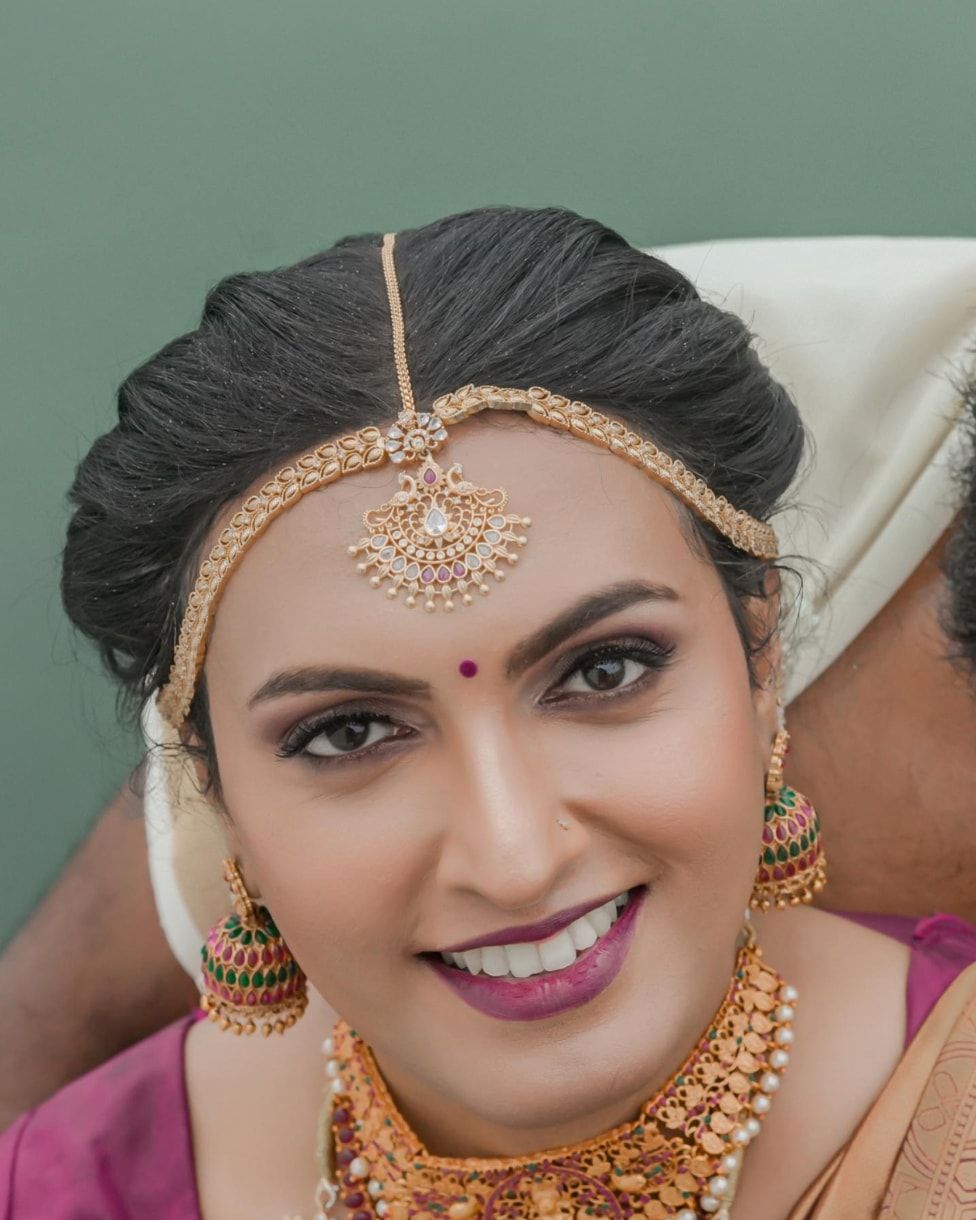 Bride with traditional gold jewellery and soft glam makeup