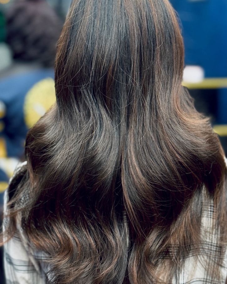 Caramel mocha highlights on long waved hair