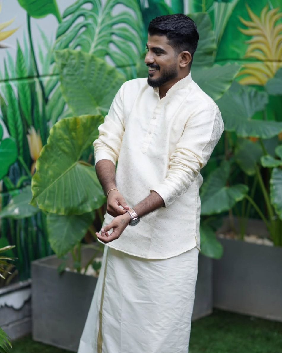 Groom in a cream kurta and mundu after his makeover