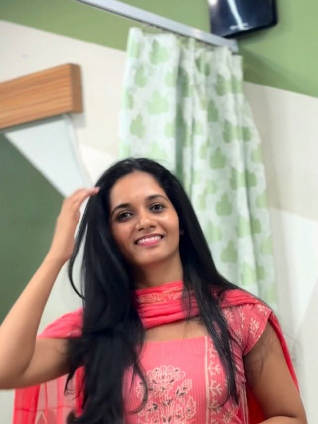 Client with long, glossy hair after a hair spa
