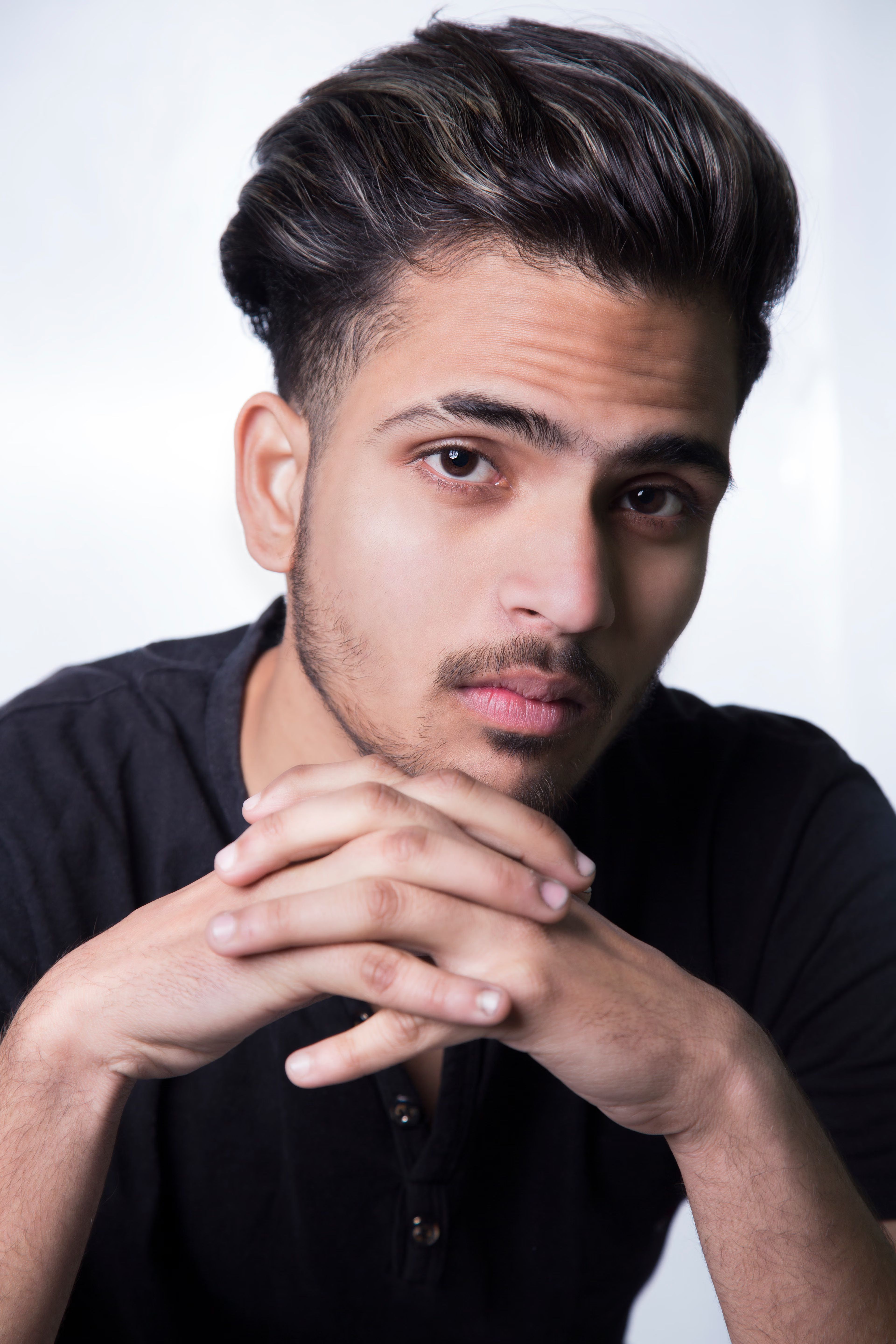 Young man with a styled dark haircut